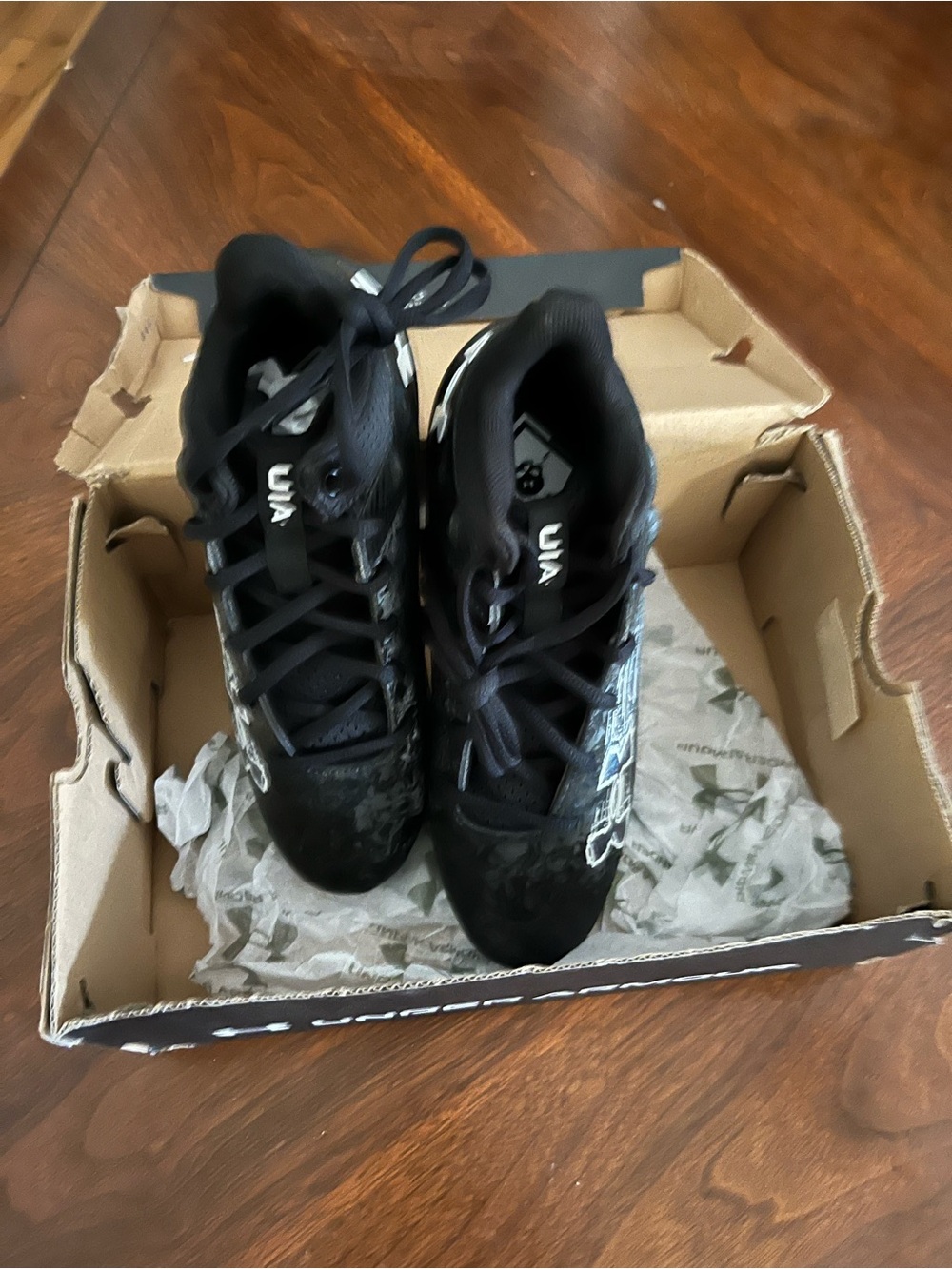 Under Armour Black Kids Athletic Shoes (cleats) with White UA Logo